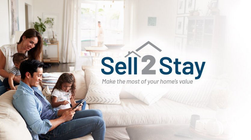Family together in a living room with Sell2Stay logo overlaid as a graphic